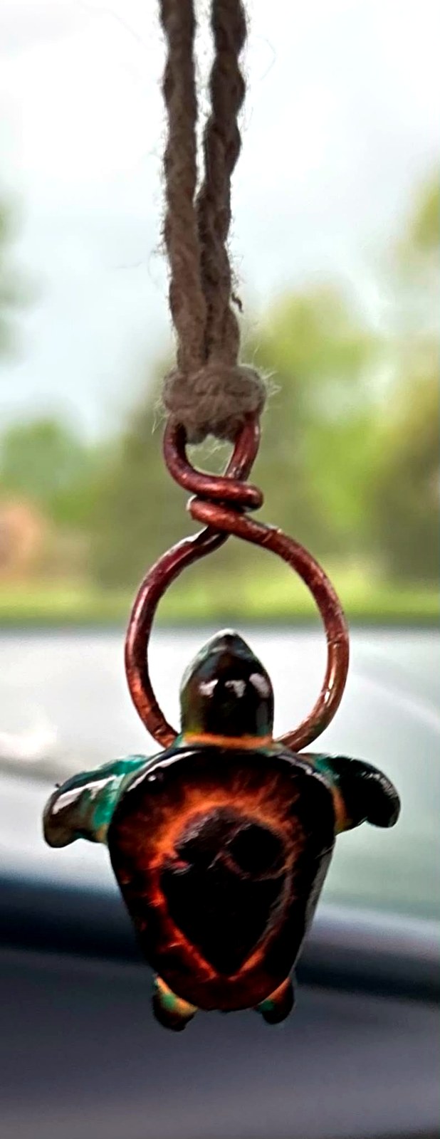 Turtle pendant ornament with copper loop and dark glossy shell